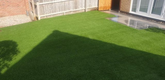 Back garden artificial grass.